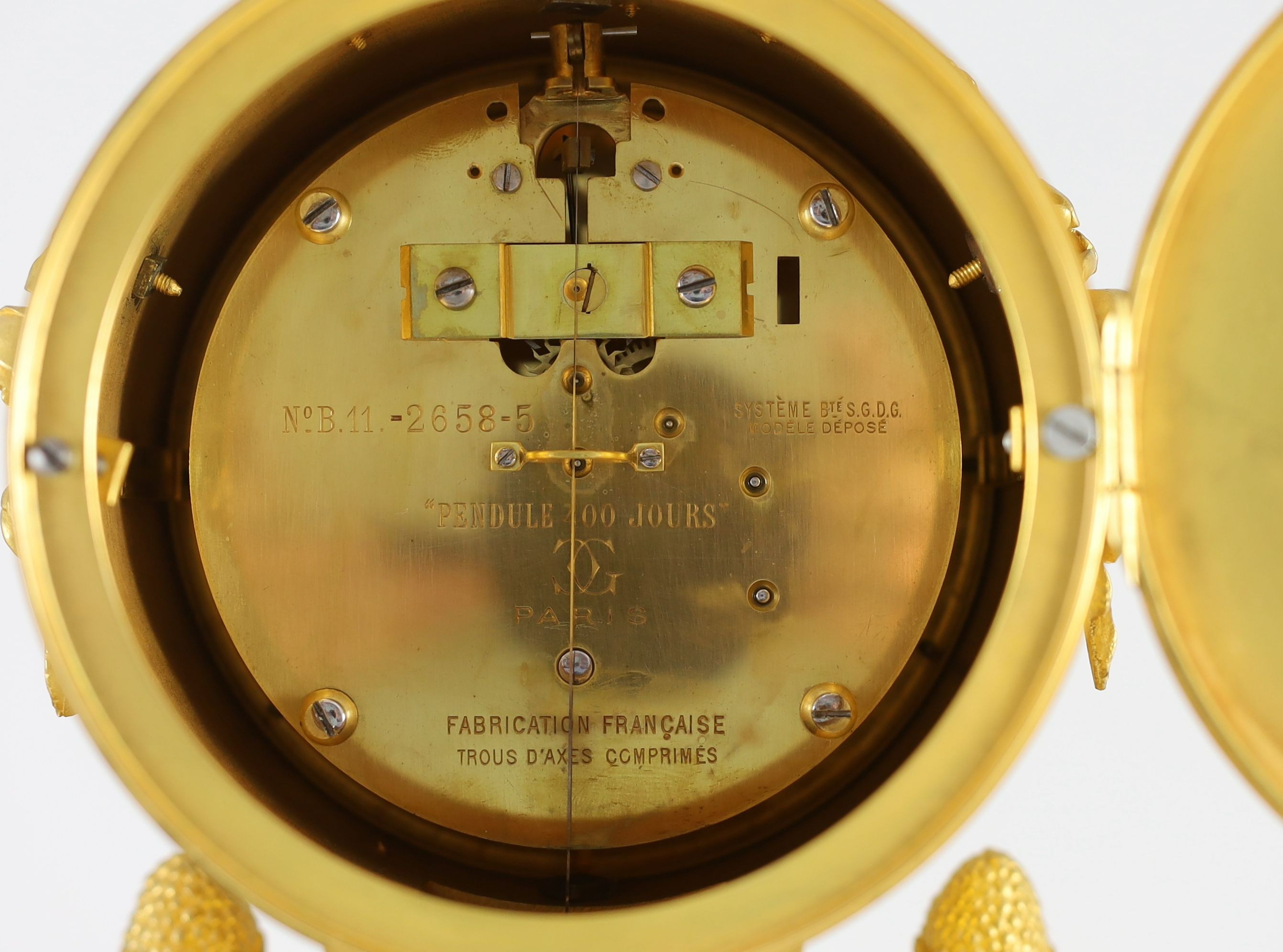 An early 20th century French ormolu 400 day mantel clock, width 26cm, depth 15cm, height 52cm